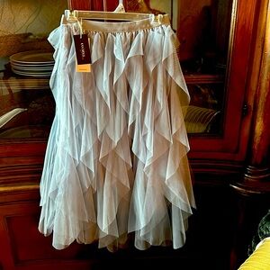 Small. Tulle skirt. Fully lined. Light smoky blue. Never worn with tags